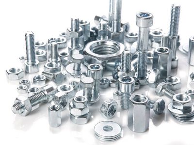 chromeplated bolts and nuts on white background